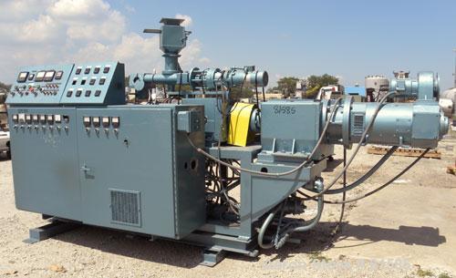 Used American Maplan Approximate 62mm Counter-Rotating Twin Screw Extruder, Model DSK62. (2) 2.44" Diameter x 48" long intermeshing tapered screws. Electrically heated, water cooled 4 zone vented bar...