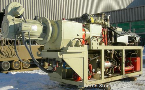 USED: American Maplan conical counter-rotating twin screw, 62 mm, model DSK62. Approximate 47.1:1 gearbox ratio. Built-in oil heating and cooling with tank, heat exchanger and pump. 4 zone top vented...