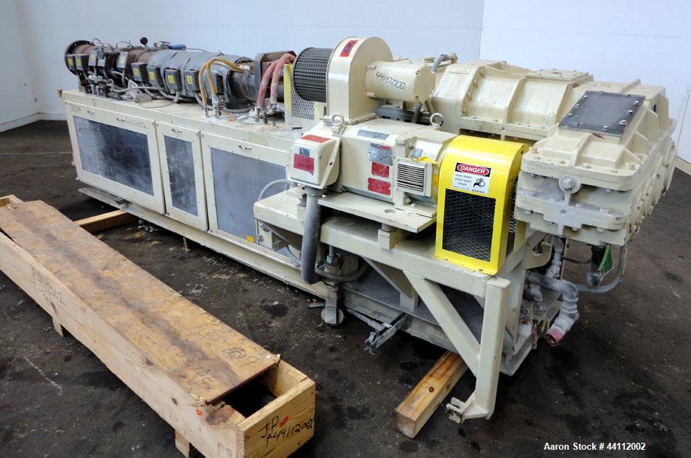 Used American Maplan 88mm Counter-Rotating Twin Screw Extruder, Model TS-88. Approximate 24 to 1 L/D ratio. (10) barrel zones, (1) section top vented, Electrically heated, liquid cooled. (2) Intermes...