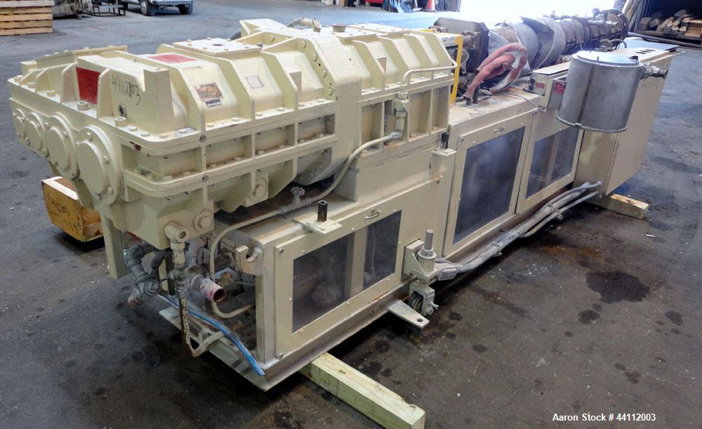 Used American Maplan 88mm Counter-Rotating Twin Screw Extruder, Model TS-88. Approximate 24 to 1 L/D ratio. (10) barrel zones, (1) section top vented, Electrically heated, liquid cooled. (2) Intermes...