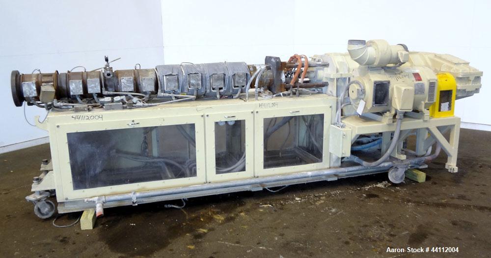 Used American Maplan 88mm Counter-Rotating Twin Screw Extruder, Model TS-88. Approximate 24 to 1 L/D ratio. (10) barrel zones, (1) section top vented, Electrically heated, liquid cooled. No screws. W...