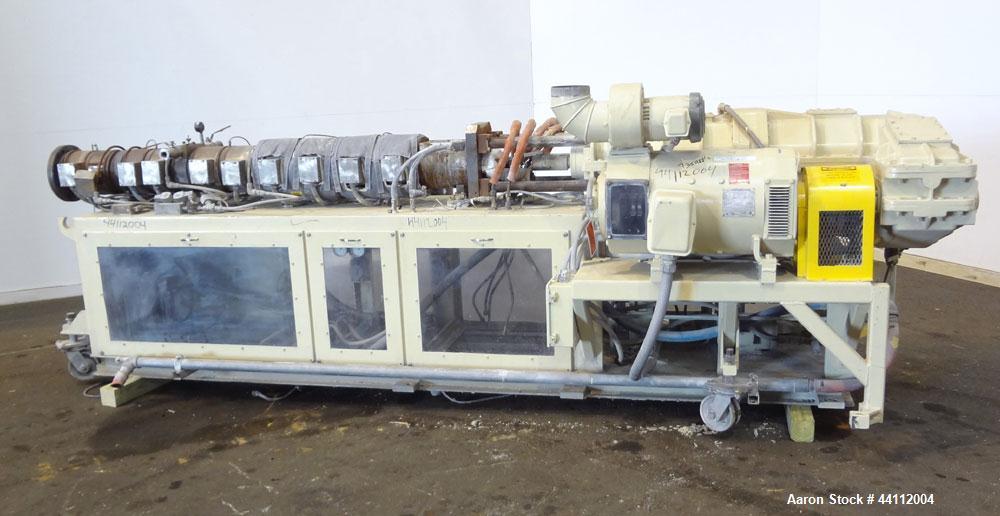 Used American Maplan 88mm Counter-Rotating Twin Screw Extruder, Model TS-88. Approximate 24 to 1 L/D ratio. (10) barrel zones, (1) section top vented, Electrically heated, liquid cooled. No screws. W...