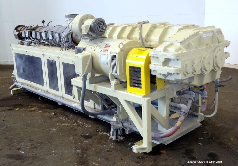 Used American Maplan 88mm Counter-Rotating Twin Screw Extruder, Model TS-88. Approximate 24 to 1 L/D ratio. (10) barrel zones, (1) section top vented, Electrically heated, liquid cooled. No screws. W...