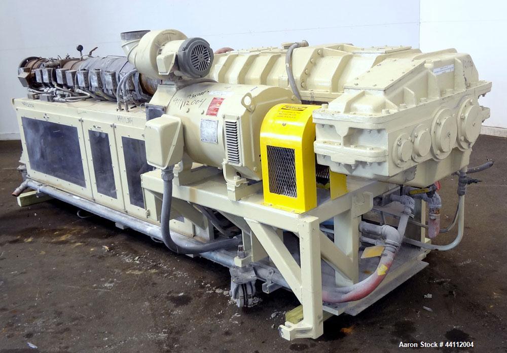 Used American Maplan 88mm Counter-Rotating Twin Screw Extruder, Model TS-88. Approximate 24 to 1 L/D ratio. (10) barrel zones, (1) section top vented, Electrically heated, liquid cooled. No screws. W...