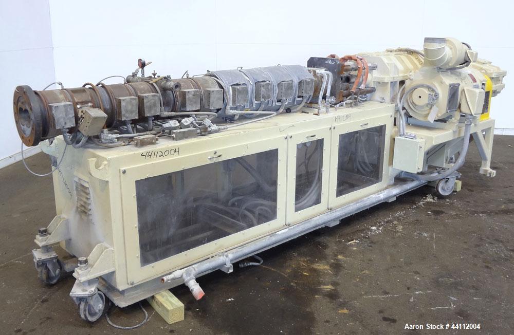 Used American Maplan 88mm Counter-Rotating Twin Screw Extruder, Model TS-88. Approximate 24 to 1 L/D ratio. (10) barrel zones, (1) section top vented, Electrically heated, liquid cooled. No screws. W...