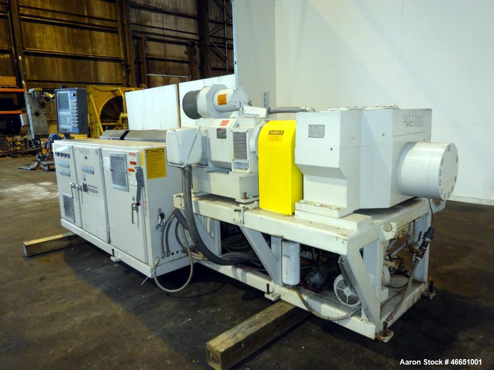 Used American Maplan 92mm Counter-Rotating Twin Screw Extruder, Model TS-92. Approximate 26 to 1 L/D ratio. 5 Zone barrel, (1) section top vented. Electrically heated, liquid cooled with pump, tank, ...