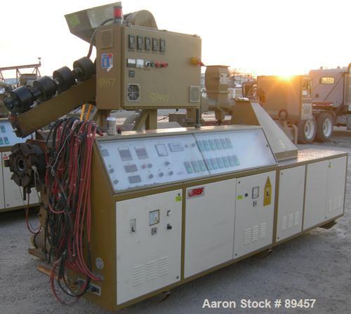 USED: Amut twin screw extruder, 92 mm screw diameter, model BA92. Approximate 24:1 L/D ratio. Counter-rotating screw design. 6 zone top vented, electrically heated, air cooled barrel with vacuum pump...