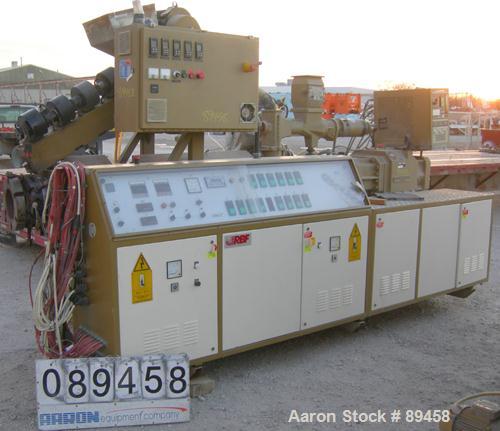 USED: Amut twin screw extruder, 92 mm screw diameter, model BA92. Approximate 24:1 L/D ratio. Counter-rotating screw design. 6 zone top vented, electrically heated, air cooled barrel with vacuum pump...