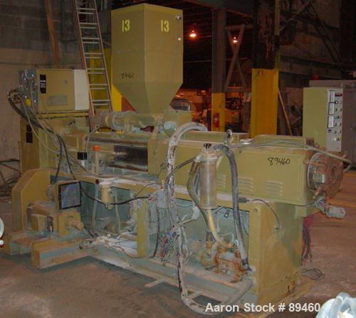 USED: Amut twin screw extruder, 92 mm screw diameter, model BA92. Approximate 22:1 L/D ratio. Counter-rotating screw design. 5 zone top vented, electrically heated, air cooled barrel with vacuum pump...