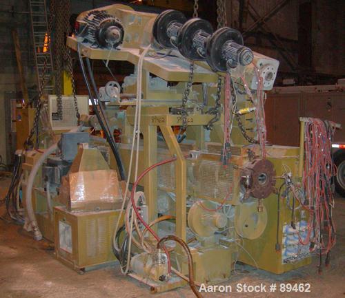 USED: Amut twin screw extruder, 92 mm screw diameter, model BA92. Approximate 24:1 L/D ratio. Counter-rotating screw design. 6 zone top vented, electrically heated, air cooled barrel with vacuum pump...