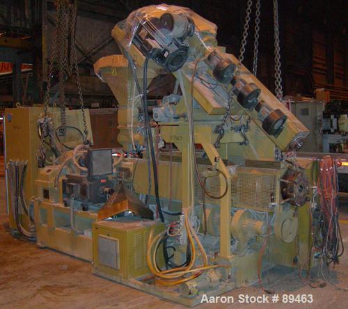 USED: Amut twin screw extruder, 92 mm screw diameter, model BA92. Approximate 24:1 L/D ratio. Counter-rotating screw design. 6 zone top vented, electrically heated, air cooled barrel with vacuum pump...