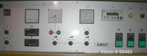 USED: Amut twin screw extruder, 92 mm screw diameter, model BA92. Approximate 22:1 L/D ratio. Counter-rotating screw design. 5 zone top vented, electrically heated, air cooled barrel with vacuum pump...