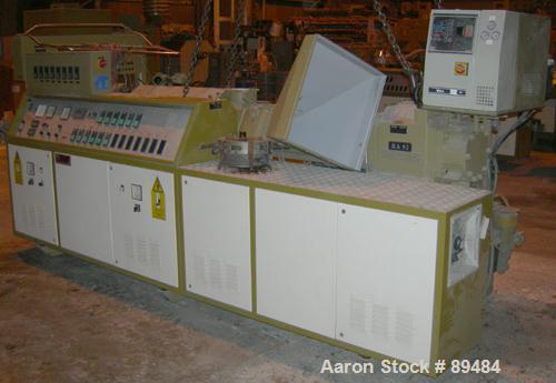USED: Amut twin screw extruder, 92 mm screw diameter, model BA92. Approximate 22:1 L/D ratio. Counter-rotating screw design. 5 zone top vented, electrically heated, air cooled barrel with vacuum pump...