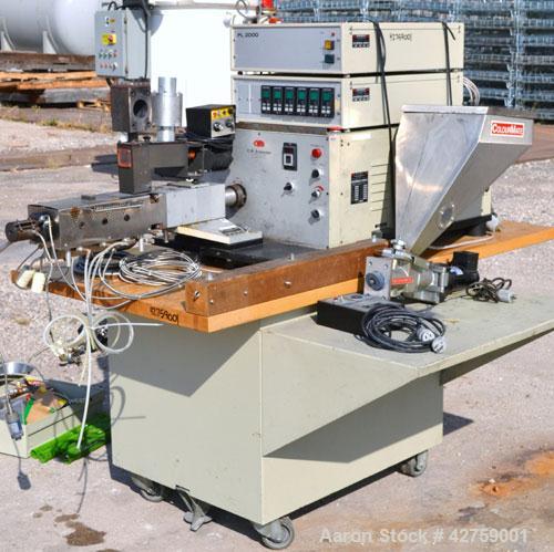 Used C.W. Brabender Plasti-Corder Extruder System Consisting Of: (1) Model CTSE-V Counter-rotating twin screw extruder, approximately 30 to 1 L/D ratio. Electrically heated, water cooled. Feed throat...