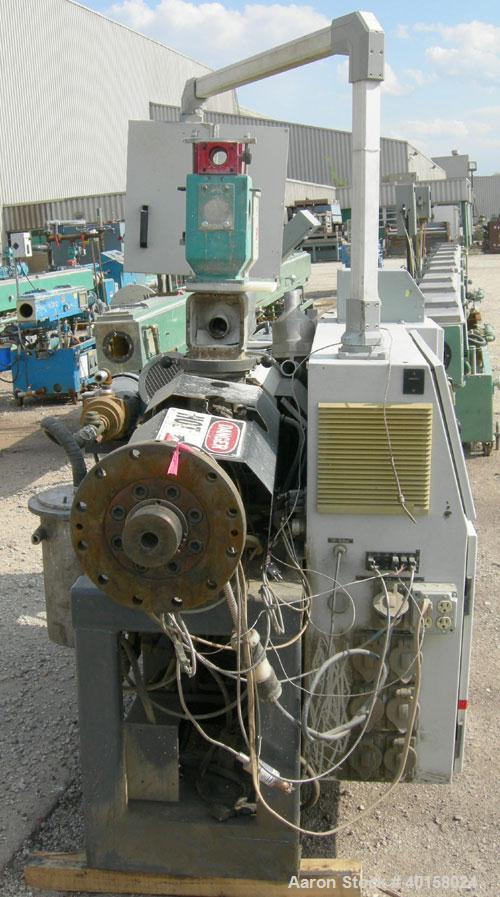 Used Cincinnati Milacron model CM35 35mm conical counter rotating twin screw extrusion equipment. New 2000. Extruder serial #E50A0200003. Has 8 zone temperature control panel utilizing Barber Coleman...