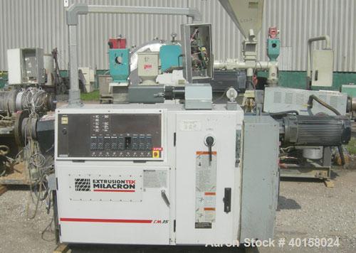 Used Cincinnati Milacron model CM35 35mm conical counter rotating twin screw extrusion equipment. New 2000. Extruder serial #E50A0200003. Has 8 zone temperature control panel utilizing Barber Coleman...