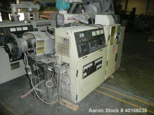 Used Cincinnati Milicron Conical Counter-Rotating Twin Screw Extruder, 35 mm, model CM35. Electrically heated, water cooled vented barrel with pump. Water cooled feed throat with a dosing feeder. App...