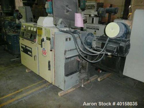 Used Cincinnati Milicron Conical Counter-Rotating Twin Screw Extruder, 35 mm, model CM35. Electrically heated, water cooled vented barrel with pump. Water cooled feed throat with a dosing feeder. App...