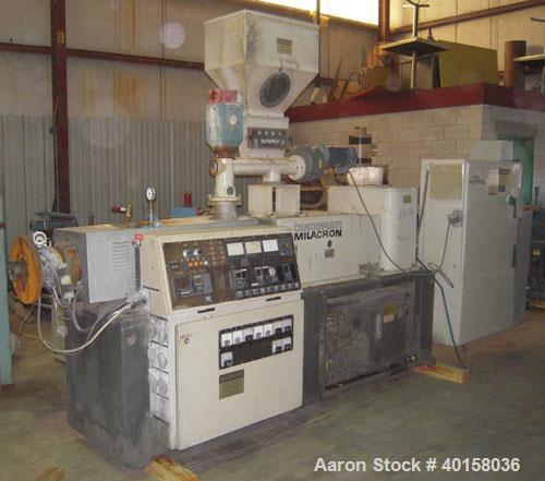 Used Cincinnati Milicron Conical Counter-Rotating Twin Screw Extruder, 55 mm, model CM55HP. Electrically heated, water cooled vented barrel with pump. Water cooled feed throat with a dosing feeder. A...