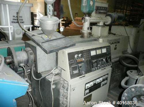 Used Cincinnati Milicron Conical Counter-Rotating Twin Screw Extruder, 55 mm, model CM55HP. Electrically heated, water cooled vented barrel with pump. Water cooled feed throat with a dosing feeder. A...