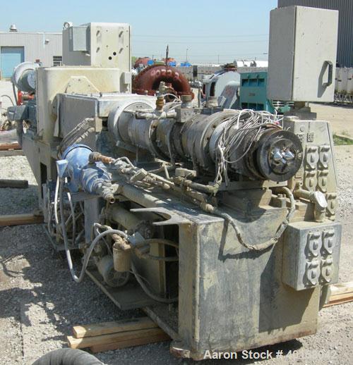 Used Cincinnati Milicron Conical Counter-Rotating Twin Screw Extruder, 80 mm, model CM80HP. Electrically heated, water cooled vented barrel with pump. Water cooled feed throat with a crammer feeder. ...