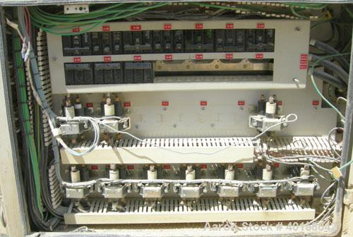 Used Cincinnati Milicron Conical Counter-Rotating Twin Screw Extruder, 80 mm, model CM80HP. Electrically heated, water cooled vented barrel with pump. Water cooled feed throat with a crammer feeder. ...