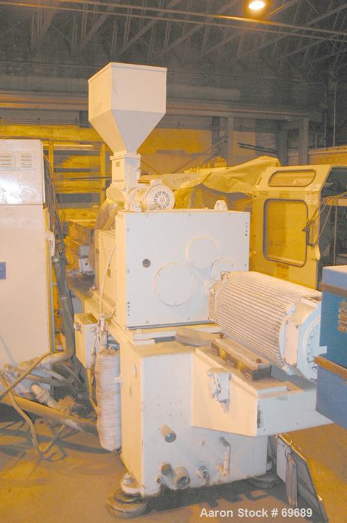 USED: Cincinnati 2.16" (55mm) diameter conical counter-rotating twinscrew extruder, moel CM55. Approx 20:1 L/D ratio. Electrically heated,water cooled, with tank and pump. Vented (plugged) barrel. 5"...