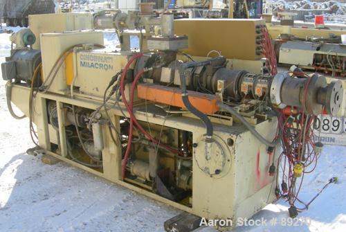 USED: Cincinnati conical counter-rotating twin screw extruder, 55 mm, model CM55. Approximate 20:1 L/D ratio. Approximate 48:1 gearbox ratio. Built-in oil heating and cooling with tank, heat exchange...