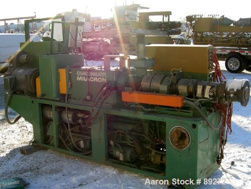 USED: Cincinnati conical counter-rotating twin screw extruder, 55 mm, model CM55. Approximate 20:1 L/D ratio. Approximate 48:1 gearbox ratio. Built-in oil heating and cooling with tank, heat exchange...