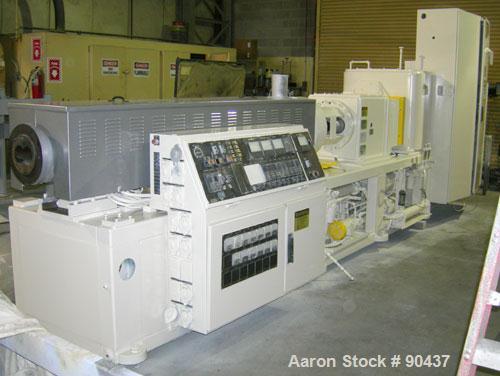 USED: Cincinnati counter-rotating twin screw extruder, 92 mm, model CM92HP. Electrically heated, water cooled 5 zone top vented barrel with tank, heat exchanger and pump. Built-in oil cooling/heating...