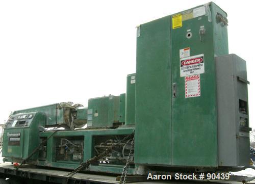 USED: Cincinnati counter-rotating twin screw extruder, 92 mm, model CM92HP. Electrically heated, water cooled 5 zone top vented barrel with tank, heat exchanger and pump. Built-in oil cooling/heating...