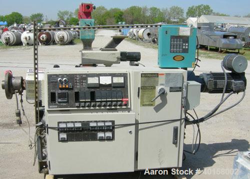 Used Cincinnati Milicron Conical Counter-Rotating Twin Screw Extruder, 35 mm, model CM35. Electrically heated, water cooled 3 zone vented barrel (no cooling system) with a Kinny vacuum pump, model A0...