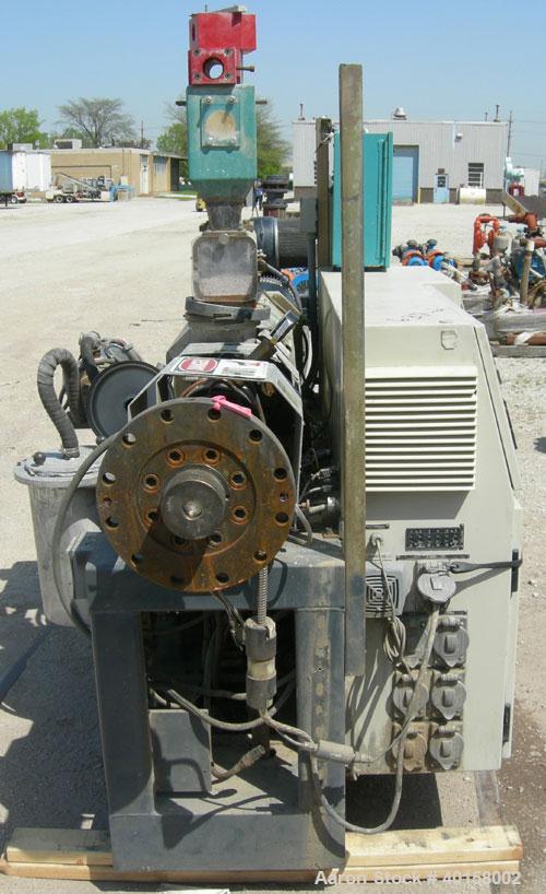 Used Cincinnati Milicron Conical Counter-Rotating Twin Screw Extruder, 35 mm, model CM35. Electrically heated, water cooled 3 zone vented barrel (no cooling system) with a Kinny vacuum pump, model A0...