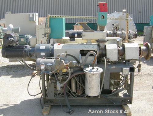 Used Cincinnati Milicron Conical Counter-Rotating Twin Screw Extruder, 35 mm, model CM35. Electrically heated, water cooled 3 zone vented barrel (no cooling system) with a Kinny vacuum pump, model A0...