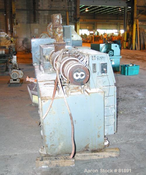 USED: Cincinnati Milacron Model CM-65HP Conical Twin Screw Counter-Rotating Extruder having an electrically heated, liquid cooled and vented barrel at an approximate 42" centerline height. Gearbox is...
