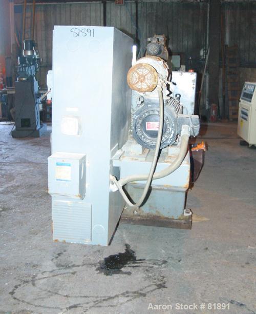 USED: Cincinnati Milacron Model CM-65HP Conical Twin Screw Counter-Rotating Extruder having an electrically heated, liquid cooled and vented barrel at an approximate 42" centerline height. Gearbox is...
