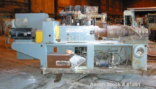 USED: Cincinnati Milacron Model CM-65HP Conical Twin Screw Counter-Rotating Extruder having an electrically heated, liquid cooled and vented barrel at an approximate 42" centerline height. Gearbox is...