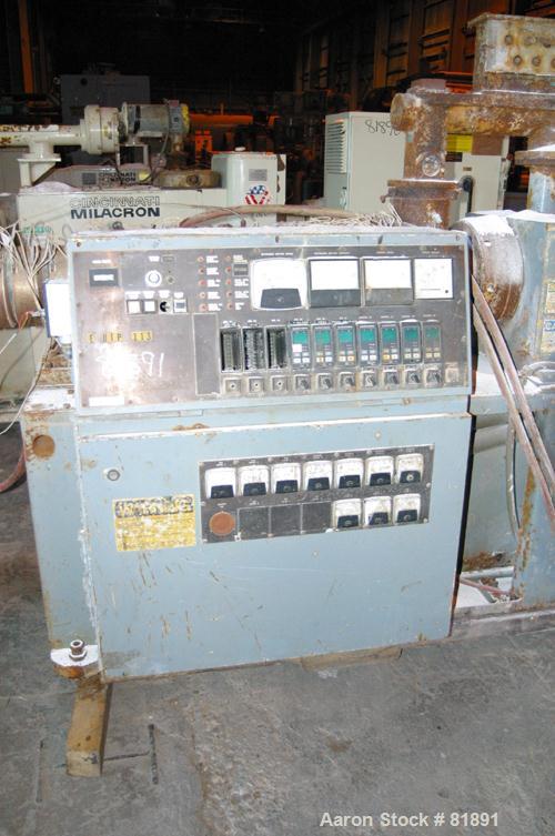 USED: Cincinnati Milacron Model CM-65HP Conical Twin Screw Counter-Rotating Extruder having an electrically heated, liquid cooled and vented barrel at an approximate 42" centerline height. Gearbox is...