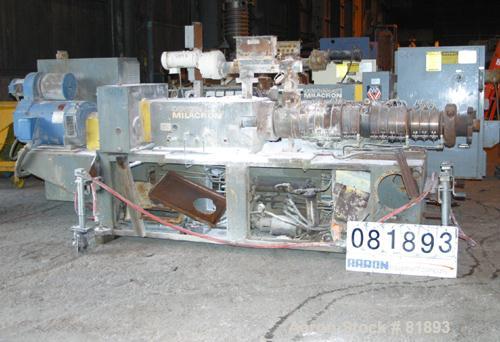 USED: Cincinnati Milacron Model CM-65HP Conical Twin Screw Counter-Rotating Extruder having an electrically heated, liquid cooled and vented barrel at an approximate 42" centerline height. Gearbox is...