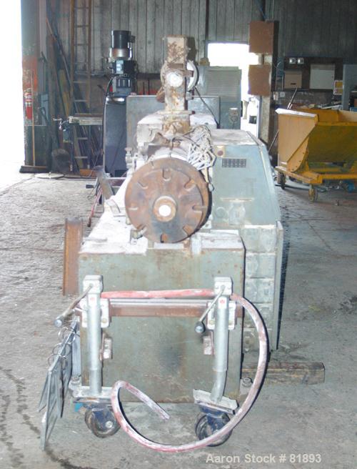 USED: Cincinnati Milacron Model CM-65HP Conical Twin Screw Counter-Rotating Extruder having an electrically heated, liquid cooled and vented barrel at an approximate 42" centerline height. Gearbox is...