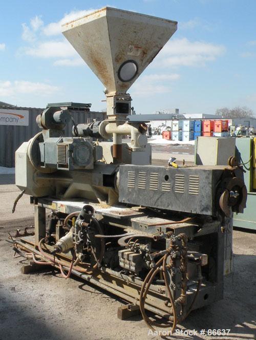 Used Cincinnati Milacron 55mm Conical Counter-Rotating Twin Screw Extruder, Model Pinnacle E55 PIN. Approximate 20 to 1 L/Dratio. Electrically heated, water cooled 3 zone vented barrel. Water cooled ...