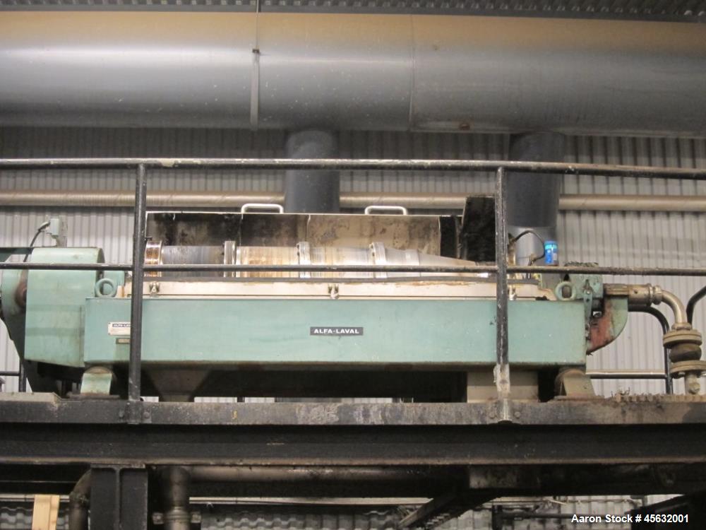 Used Cincinnati Milacron 65MM Counter-Rotating Conical Twin Screw Extruder, Model E65. Includes 50 hp AC motor with inverter, temperature control panel, starve feeder, electrically heated, water cool...