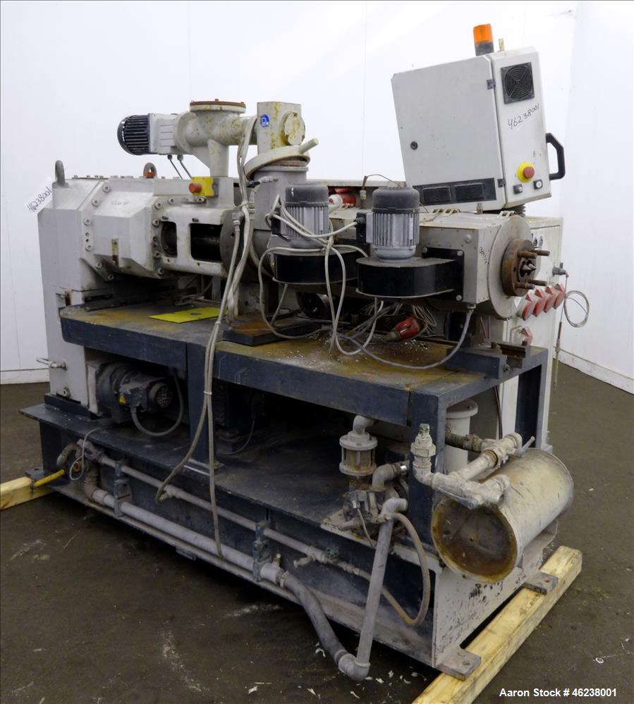 Used Cincinnati Extrusion 45mm Conical Twin Screw Extruder Type Titan 45P-APC. 1.77" (45 mm)/ 3.74" (95 mm) conical screws. Electrially heated, air cooled 3 zone barrel. Water cooled feed throat with...
