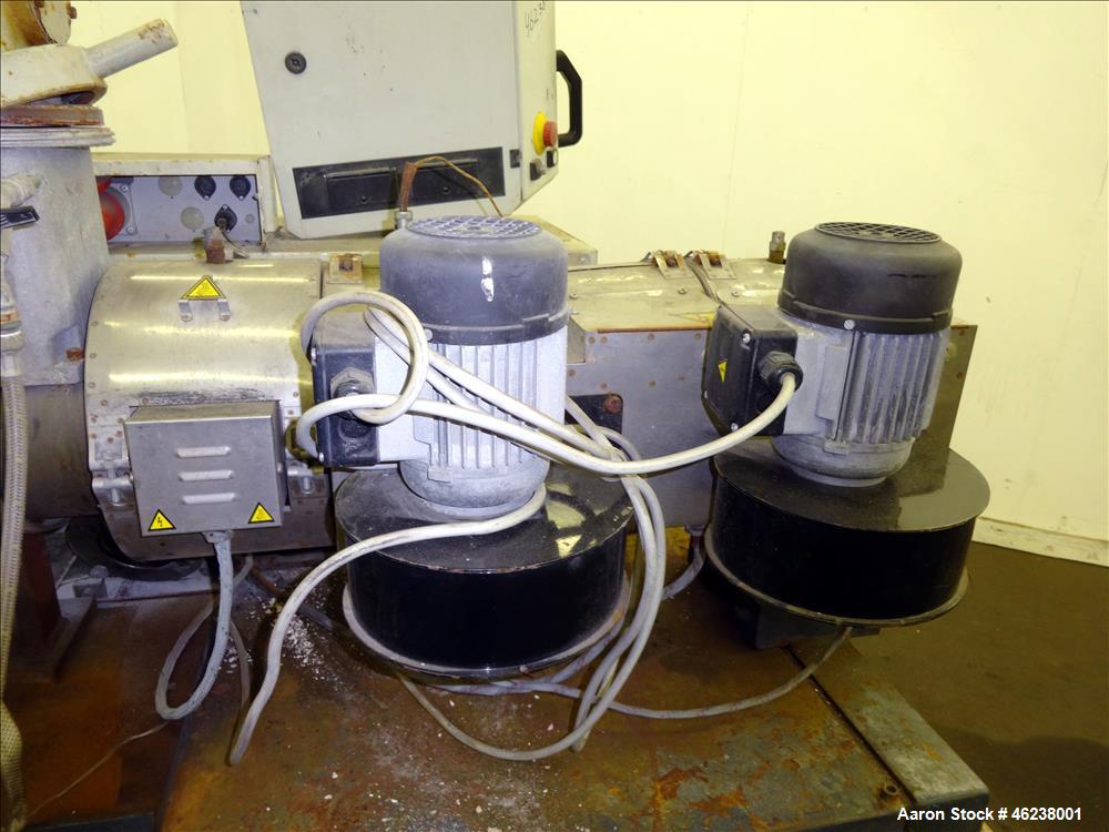 Used Cincinnati Extrusion 45mm Conical Twin Screw Extruder Type Titan 45P-APC. 1.77" (45 mm)/ 3.74" (95 mm) conical screws. Electrially heated, air cooled 3 zone barrel. Water cooled feed throat with...