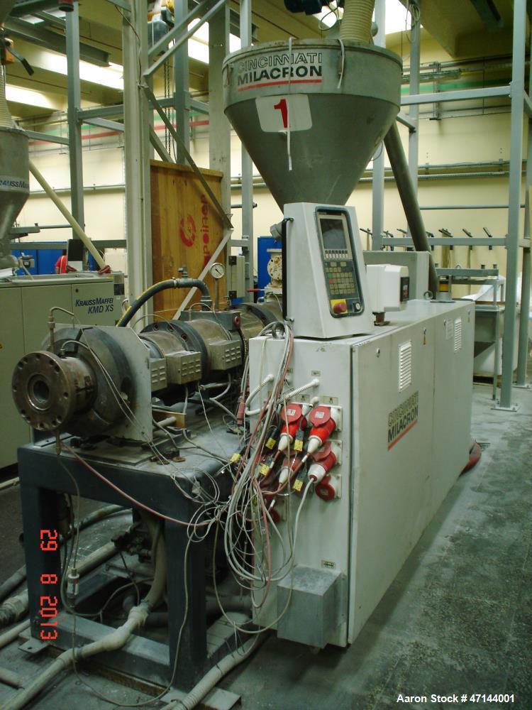 Used Cincinnati Twin-Screw Extruder Conical Milacron CMT 80-L. Year of production: 1995. Work hours: 39218 h D.C. shunt motor: 46kW Rating, installed and set: 1480.0 min-1 Speed: 297 Nm Torque: 0.7 k...