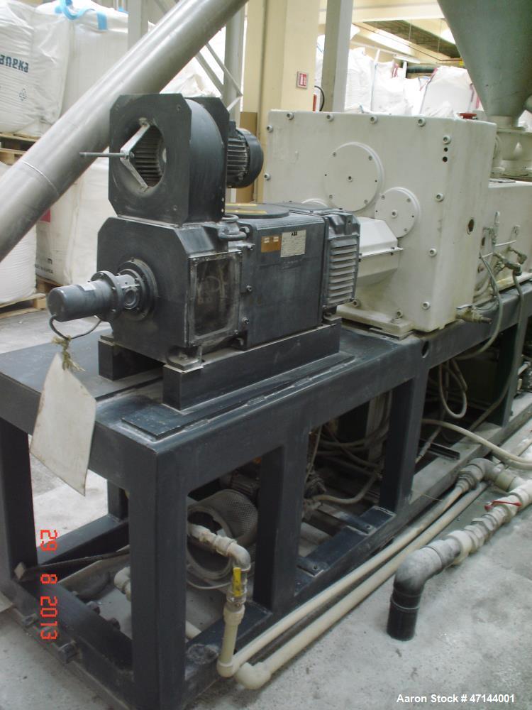 Used Cincinnati Twin-Screw Extruder Conical Milacron CMT 80-L. Year of production: 1995. Work hours: 39218 h D.C. shunt motor: 46kW Rating, installed and set: 1480.0 min-1 Speed: 297 Nm Torque: 0.7 k...