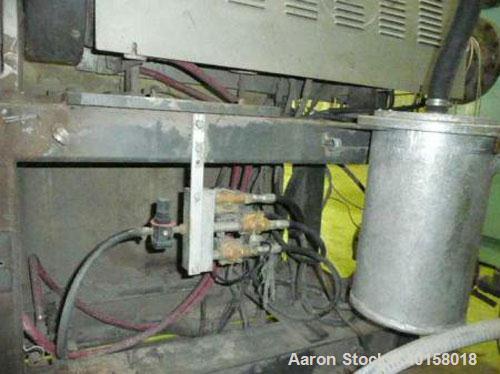 Used Cincinnati Milicron Conical Counter-Rotating Twin Screw Extruder, 55 mm, model E55 Pinnacle. Electrically heated, water cooled vented barrel with pump. Water cooled feed throat with a dosing fee...