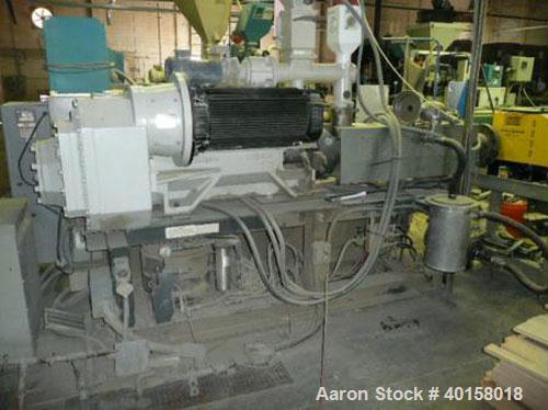 Used Cincinnati Milicron Conical Counter-Rotating Twin Screw Extruder, 55 mm, model E55 Pinnacle. Electrically heated, water cooled vented barrel with pump. Water cooled feed throat with a dosing fee...