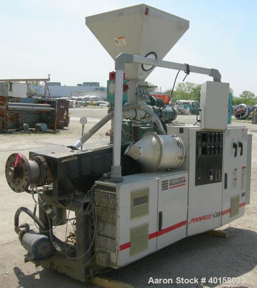 Used 55mm Cincinnati conical, counter rotating twin screw extruder. Has electrically heated, water cooled vented barrel, starve feeder, driven by 40 hp Reliance DC motor with SCR control. Extruder ha...