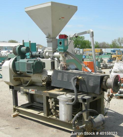 Used 55mm Cincinnati conical, counter rotating twin screw extruder. Has electrically heated, water cooled vented barrel, starve feeder, driven by 40 hp Reliance DC motor with SCR control. Extruder ha...